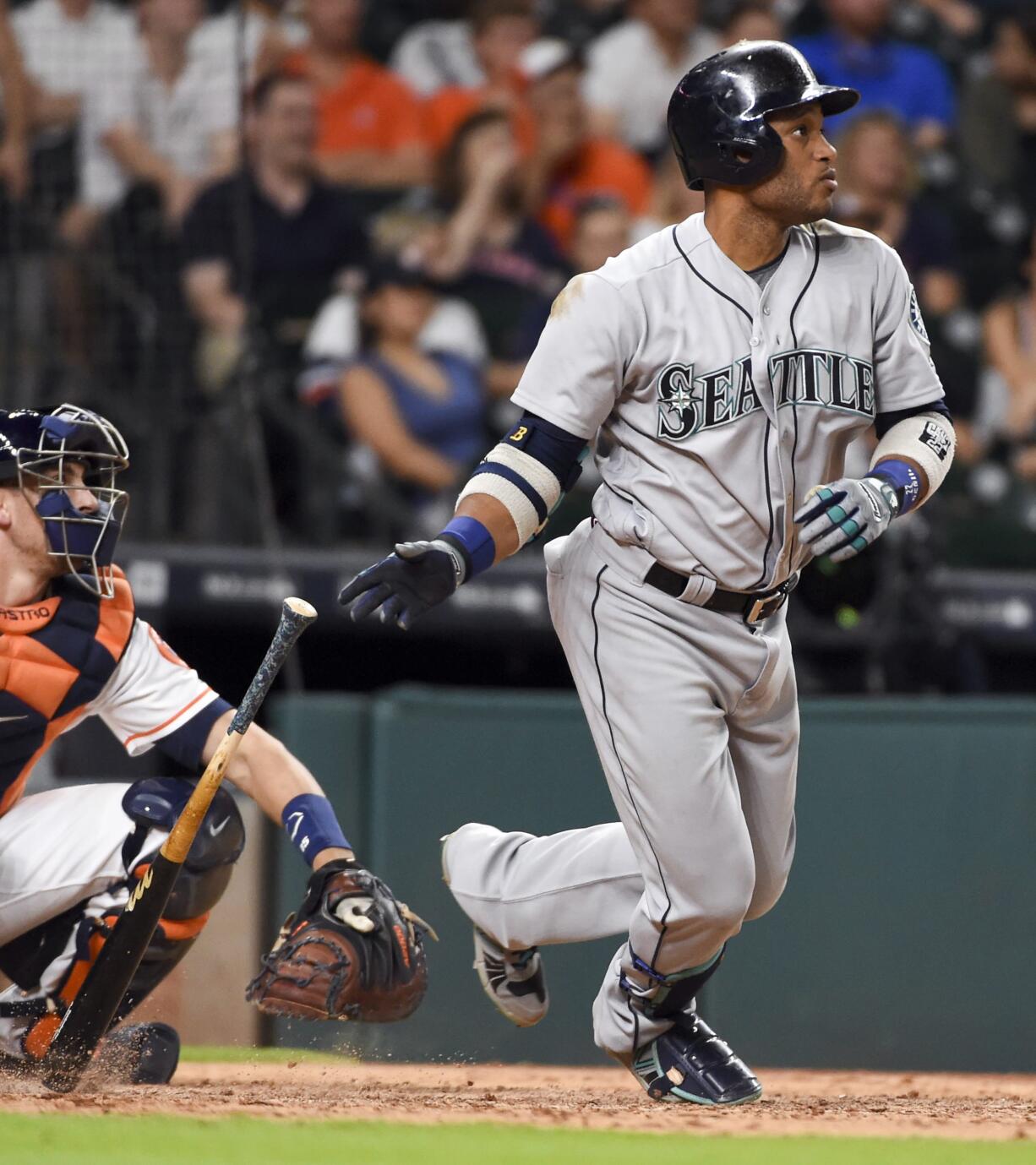 Seattle Mariners' Robinson Cano watches his three-run double in the ninth inning of a baseball game against the Houston Astros, Thursday, May 5, 2016, in Houston.