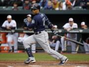 Seattle Mariners' Robinson Cano doubles in the first inning of a baseball game against the Baltimore Orioles in Baltimore, Tuesday, May 17, 2016.