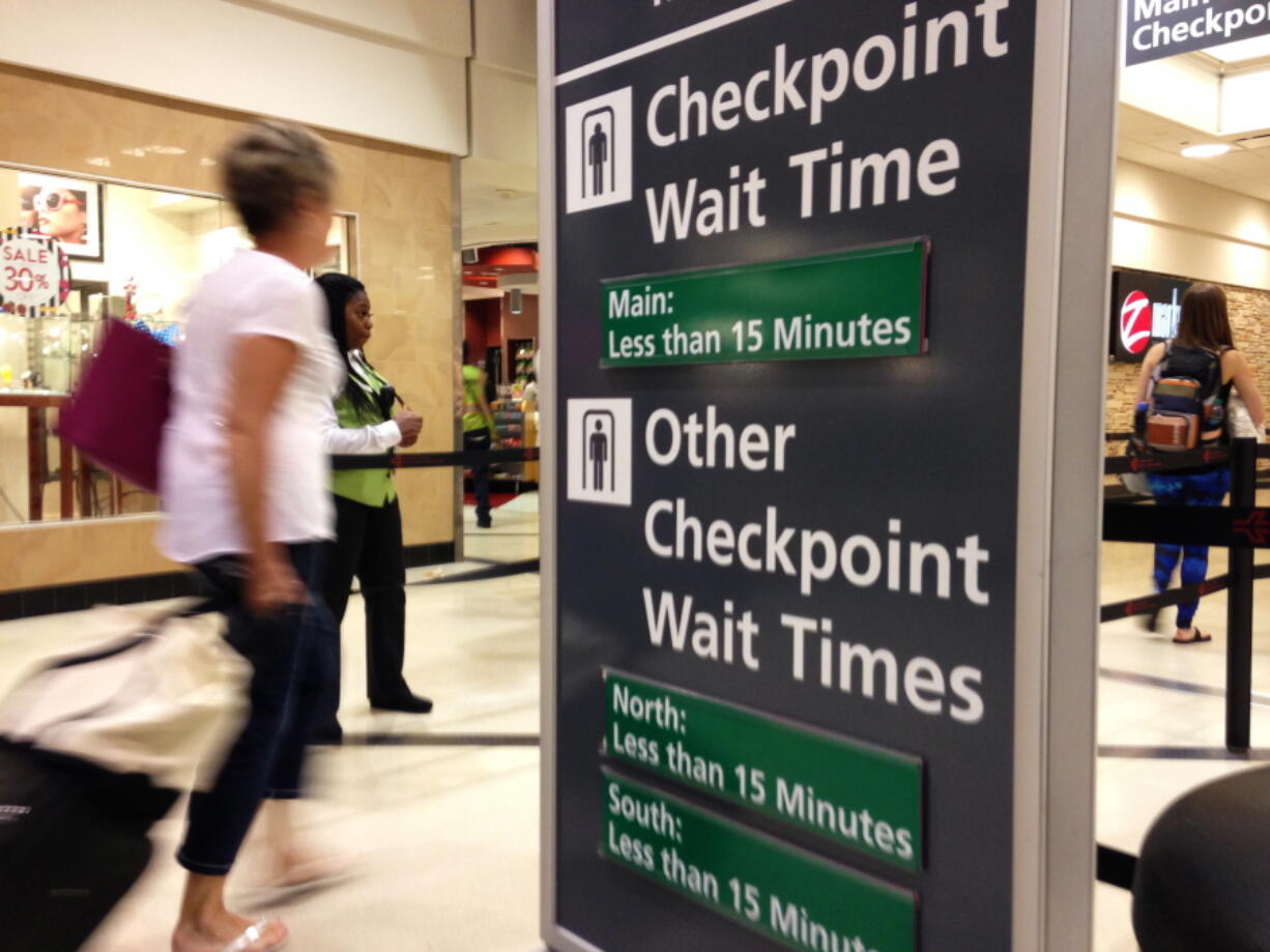 Airline passengers enter the main security checkpoint Monday at Hartsfield-Jackson International Airport in Atlanta. Travelers who had braced for long lines and long waits were instead moving through most U.S. airports fairly quickly Monday, as the busy Memorial Day travel weekend drew to a close.