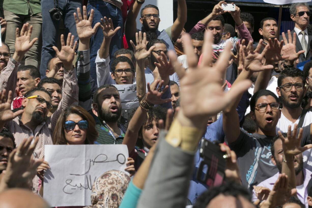 Egyptians shout slogans against Egyptian President Abdel-Fattah el-Sissi during a protest against the decision to hand over control of two strategic Red Sea islands to Saudi Arabia in front of the Press Syndicate, in Cairo, Egypt.