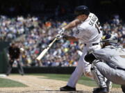 Seattle Mariners&#039; Kyle Seager hits a two-run home run as San Diego Padres catcher Derek Norris looks on in the sixth inning of a baseball game Monday, May 30, 2016, in Seattle.