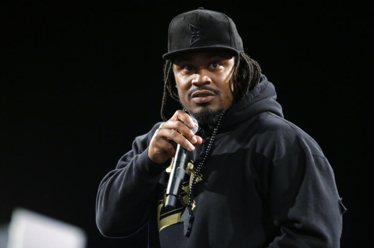 Marshawn Lynch, a former NFL football running back with the Seattle Seahawks, speaks Thursday, May 5, 2016, at a job fair in Seattle sponsored by the 100,000 Opportunities Initiative, an organization backed by Starbucks and other companies that seeks to increase employment and education opportunities for youth aged 16-24. The Seahawks announced Thursday that Lynch has been placed on the reserve/retired list. (AP Photo/Ted S.