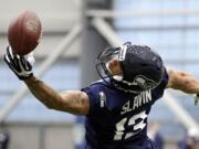 Seattle Seahawks' Tyler Slavin reaches for a pass during an NFL football rookie minicamp workout Sunday, May 8, 2016, in Renton, Wash. He was one of five players signed by the Seahawks on Monday.