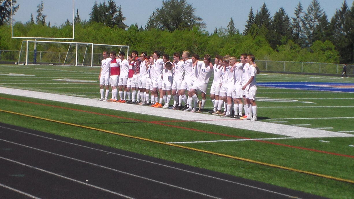 The Ridgefield boys soccer team signs the school fight song after beating Aberdeen 1-0 in the first round of the 2A district tornament (Tim Martinez/The Columbian)