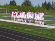 The Ridgefield boys soccer team signs the school fight song after beating Aberdeen 1-0 in the first round of the 2A district tornament (Tim Martinez/The Columbian)