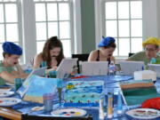 Nicole Nussbaum, Katie Pollack, Kristen Nussbaum and Robert Nussbaum paint vacation scenes as part of an Easel Like Sunday Morning-themed Sunday brunch in June at a vacation home in North Topsail Beach, N.C.