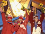 The three Olympic medalists in the women&#039;s 5-kilometer free pursuit alpine skiing event, Russian silver medalist, Larissa Lazutina, left, Russian gold medalist Olga Danilova, center and Canadian bronze medalist Beckie Scott, right, acknowledge the crowd Feb. 15, 2002, after receiving their medals at Medals Plaza in downtown Salt Lake City. Scott gave a speech Thursday in Montreal that reminded all the leaders at the World Anti-Doping Agency why they&#039;re doing all this work.