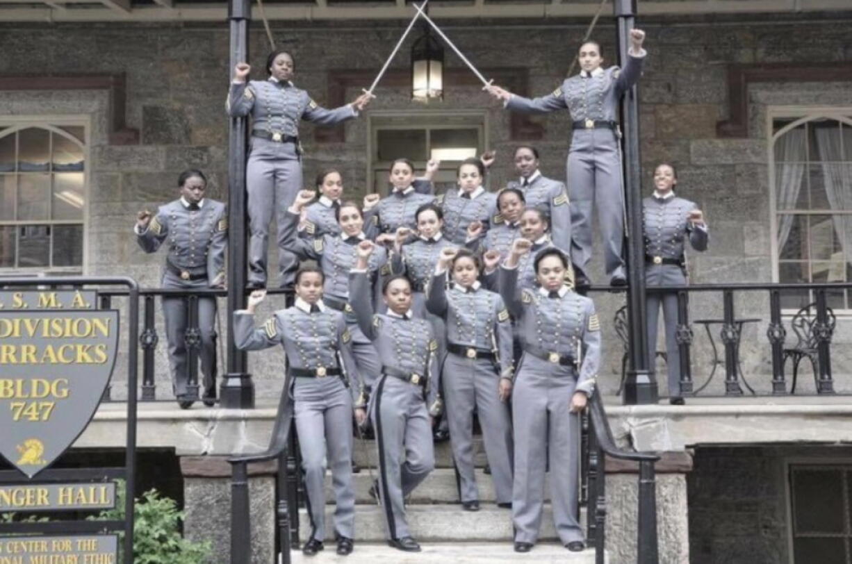 This undated image taken from Twitter shows 16 black, female cadets in uniform with their fists raised at the United States Military Academy at West Point, N.Y.