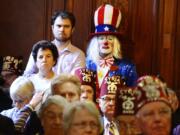 Clowns, including Jeff Cox, back, crowd the City Council chamber during a City Council hearing on a proposed wild-animal entertainment ban that would keep circuses and similar shows out of the city, Tuesday, May 24, 2016. Syria Shrine clowns also held signs outside the City-County Building begging the City Council not to enact the measure.