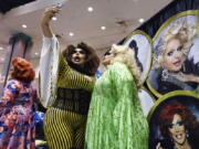 Drag queen Darienne Lake, right, poses for a selfie with a fan at RuPaul&#039;s DragCon on May 7 at the Los Angeles Convention Center in Los Angeles.