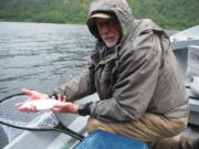 Ed Wickersham of Vancouver holds a typical Coldwater Lake trout.