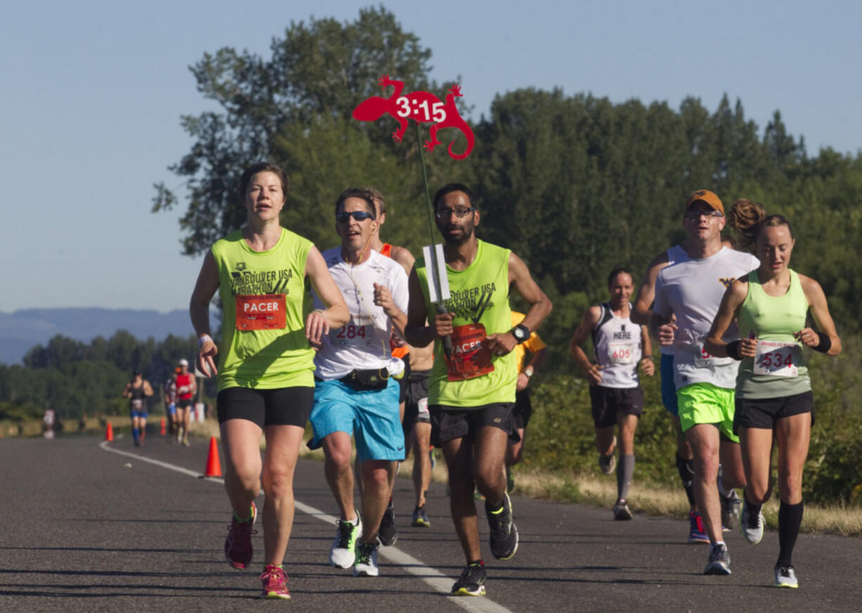 Runners take part in the Vancouver Marathon, near Vancouver Lake Sunday June 19 2016.