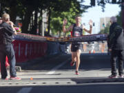 Brent Corbitt, the winner Vancouver Marathon, crosses the finish line in downtown Vancouver Sunday June 19 2016. Corbitt, from Arkansas, reported that this was his first marathon.