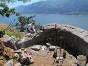 Stonemason Michael Byrne of Parkdale, Ore., works on the Oak View Overlook on Cape Horn trail in western Skamania County.