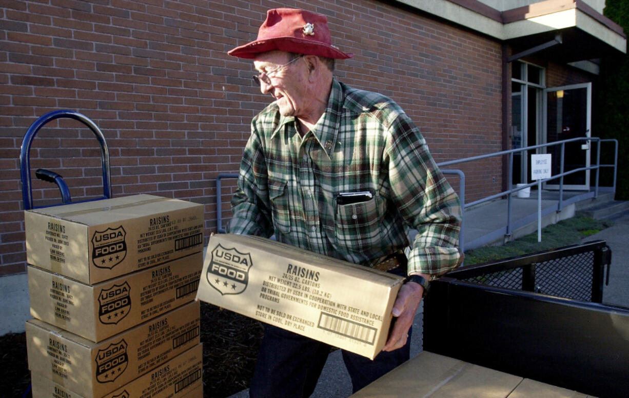 Bill Jessett, shown in 2003, volunteered to help feed the needy with the Inter-Faith Treasure House for around 30 years. He was killed in a car crash in Camas on Wednesday. He was 88.