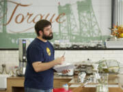 Torque Coffee Roasters owner Ryan Palmer, pictured in the cafe&#039;s former location on Columbia Street, racked up a debt of unpaid loans and back rent for his business that two lawsuits put at more than $90,000.