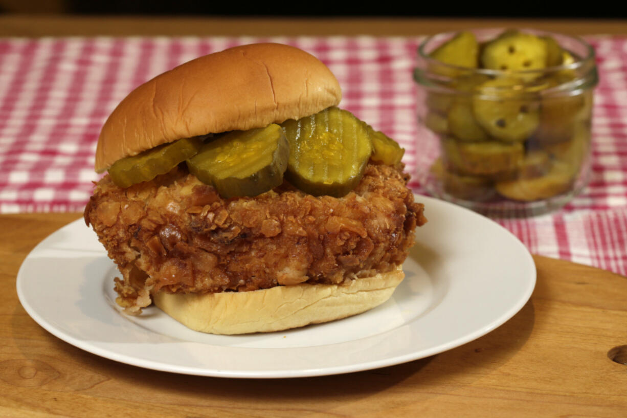 A fried chicken breast needs only pickles.