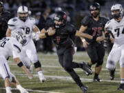 Camas quarterback Liam Fitzgerald (7) runs in playoff game between Skyview and Camas.