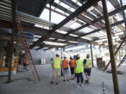 Visitors learn more about the facilities on the first floor Tuesday at the new Seton Catholic College Preparatory School under construction in Northeast Vancouver.