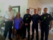 Clark County Fire District 3 Chief Steve Wrightson, from left, Life Saver Award recipient Donna Welker, and the district&#039;s Josh Haldeman, Jens Tapio and Nolan Meyer, pose for a photo. Welker was honored for her efforts to help a choking woman in Battle Ground in May.