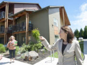 U.S. Sen. Maria Cantwell, right, visits 1st Street Apartments, a complex in east Vancouver built using low-income housing tax credits.