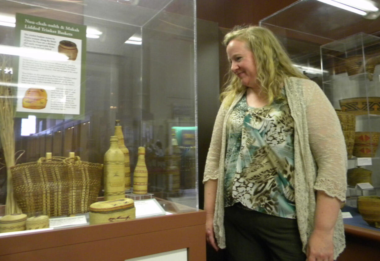 Katie Anderson, executive director of the Clark County Historical Museum, with a display of Indian basketry nearing the end of its run.