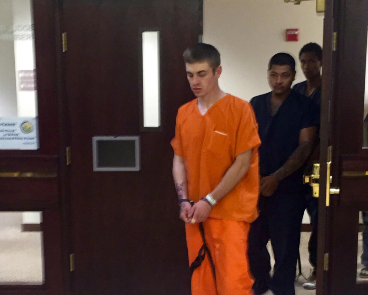 Montgomery Hedges, front, appears Tuesday in Clark County Superior Court after allegedly ramming Vancouver police cars with his vehicle Monday morning.