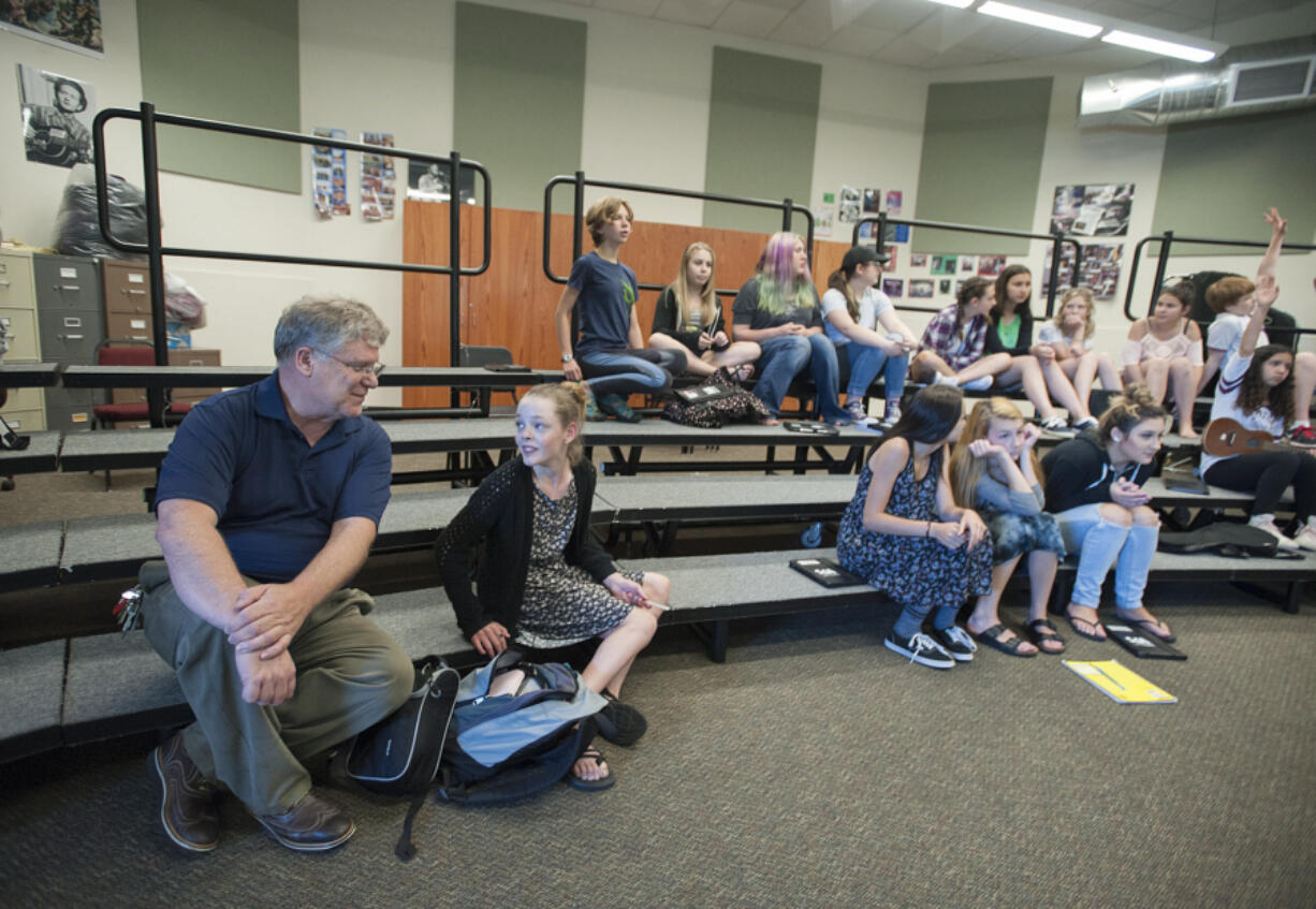 Jim O&#039;Banion, principal at Vancouver School of Arts and Academics, left, chats with seventh-grader Bria Austin, 13, in the band room where he was a junior-high musician in the 1960s.