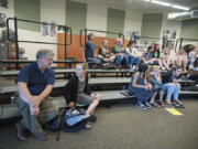 Jim O&#039;Banion, principal at Vancouver School of Arts and Academics, left, chats with seventh-grader Bria Austin, 13, in the band room where he was a junior-high musician in the 1960s.