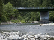 A motorist drives past Daybreak Regional Park near Battle Ground on June 14. Clark County is seeking grants to improve walking trails and salmon habitat along the river.