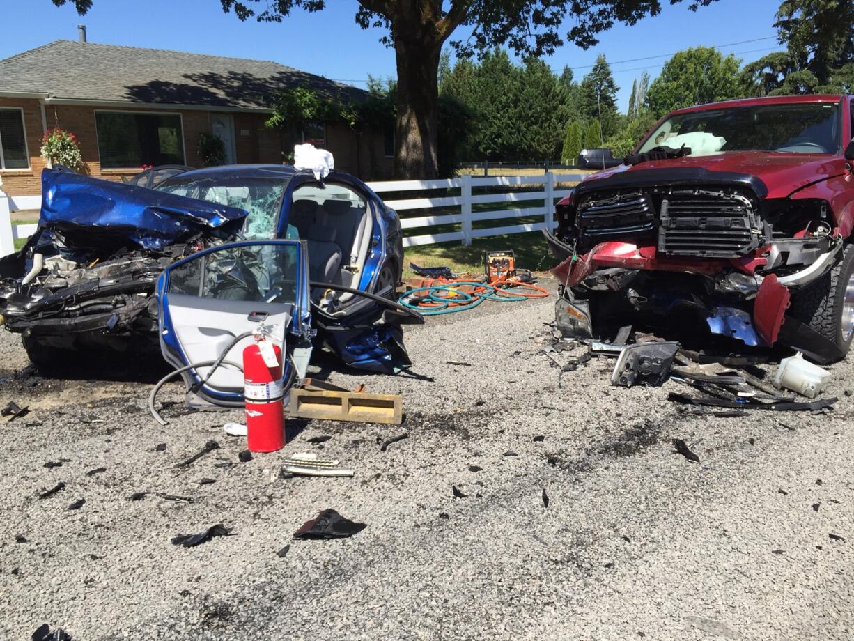 Three people were taken to a hospital -- one, the driver of the blue car, with serious injuries -- following this apparent head-on crash Tuesday afternoon near the Washington State University-Vancouver campus.