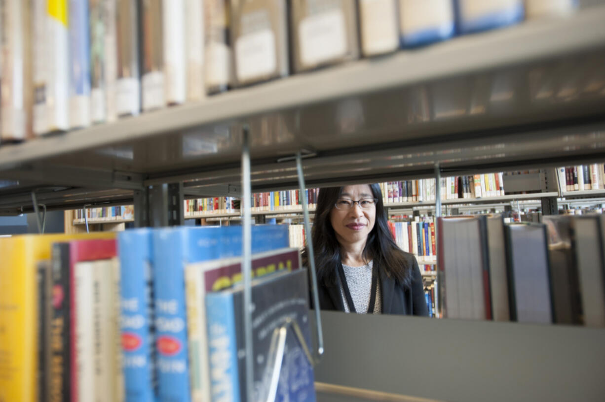 Reference librarian Supisa Oliver at work at the Vancouver Community Library in downtown Vancouver.