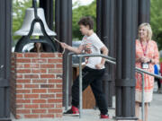 Nicholas Zook was the last fifth-grader to ring the bell at Hazel Dell Elementary School on Thursday morning. The longtime tradition of ringing the old school bell marks the last day of the school year. Principal Mychael Irwin officiates.