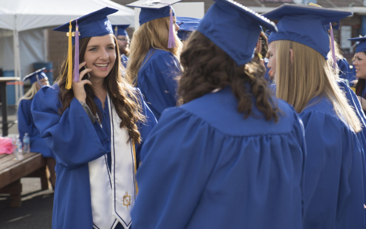 Kiana Walker, left, was one of 23 students to earn a bachelor&#039;s degree Thursday night from Clark College&#039;s dental hygiene program, the school&#039;s first baccalaureate program.