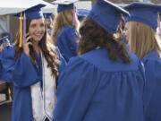 Kiana Walker, left, was one of 23 students to earn a bachelor&#039;s degree Thursday night from Clark College&#039;s dental hygiene program, the school&#039;s first baccalaureate program.