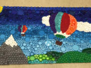 A mural made from bottle caps collected and painted by Lara Alford&#039;s fourth-grade class at Fircrest Elementary School.