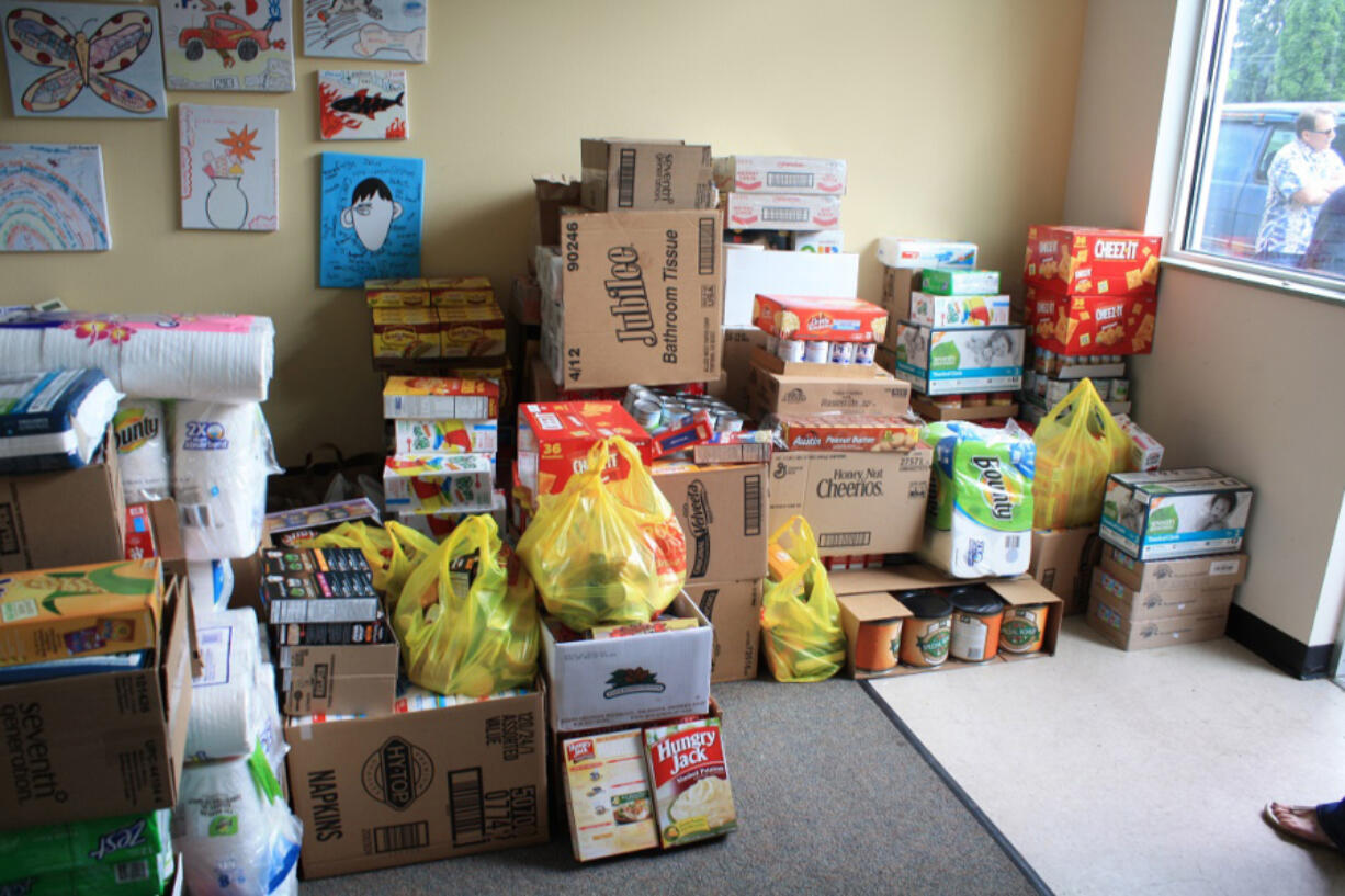 Some of the food collected during a monthlong drive by Windermere Stellar real estate agents, who also served food at all Meals on Wheels locations in the county as part of their Community Service Day.