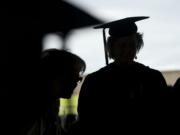 Graduates enter the 2013 Clark College Commencement at the Sleep Country Amphitheater, Thursday, June 20, 2013.