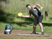 Casey Kramer plays disc golf at Leverich Park in Vancouver. A plan to build another course in Vancouver, at Frenchman&#039;s Bar Park, has been put on hold.