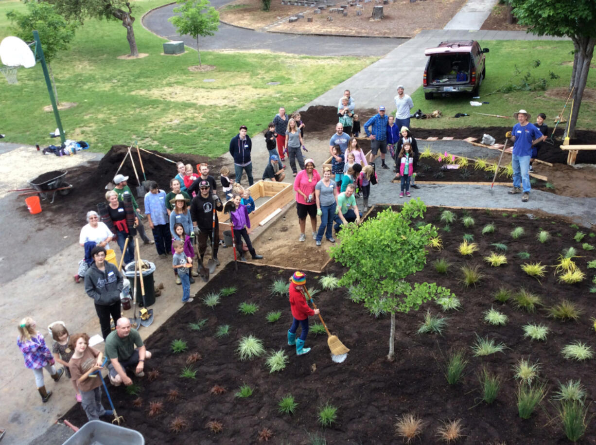 Hough: Volunteers complete Hough Elementary School&#039;s Alphabet Garden, the fifth phase in the school&#039;s Our Backyard Field Trip project.