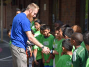 Harney Heights: Portland Timbers defender Nat Borchers spends time with Martin Luther King Elementary School&#039;s King Cubs college-prep soccer club on May 17, teaching the kids about respect, education and hard work.