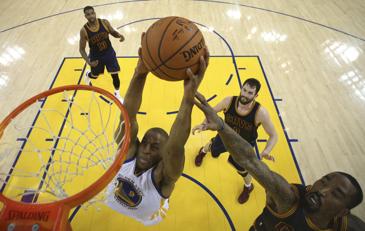 Golden State Warriors forward Andre Iguodala (9) dunks against the Cleveland Cavaliers during the first half of Game 2 of basketball's NBA Finals in Oakland, Calif., Thursday, June 2, 2016.