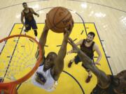 Golden State Warriors forward Andre Iguodala (9) dunks against the Cleveland Cavaliers during the first half of Game 2 of basketball's NBA Finals in Oakland, Calif., Thursday, June 2, 2016.