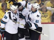 San Jose Sharks' Logan Couture (39) celebrates his goal against the Pittsburgh Penguins with teammates during the first period in Game 5 of the NHL hockey Stanley Cup Finals on Thursday, June 9, 2016, in Pittsburgh. (AP Photo/Gene J.