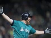 Seattle Mariners' Adam Lind celebrates his three-run home run off of St. Louis Cardinals relief pitcher Trevor Rosenthal during the ninth inning of a baseball game, Friday, June 24, 2016, in Seattle. The Mariners won 4-3.