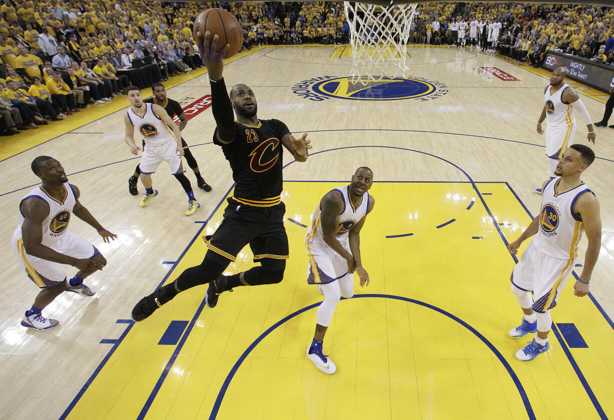 Cleveland Cavaliers forward LeBron James (23) shoots against the Golden State Warriors during the first half of Game 5 of basketball's NBA Finals in Oakland, Calif., Monday, June 13, 2016. (AP Photo/Marcio J.