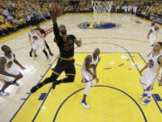 Cleveland Cavaliers forward LeBron James (23) shoots against the Golden State Warriors during the first half of Game 5 of basketball's NBA Finals in Oakland, Calif., Monday, June 13, 2016. (AP Photo/Marcio J.