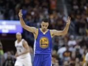 Golden State Warriors guard Stephen Curry (30) celebrates a basket against the Cleveland Cavaliers during the second half of Game 4 of basketball's NBA Finals in Cleveland, Friday, June 10, 2016.