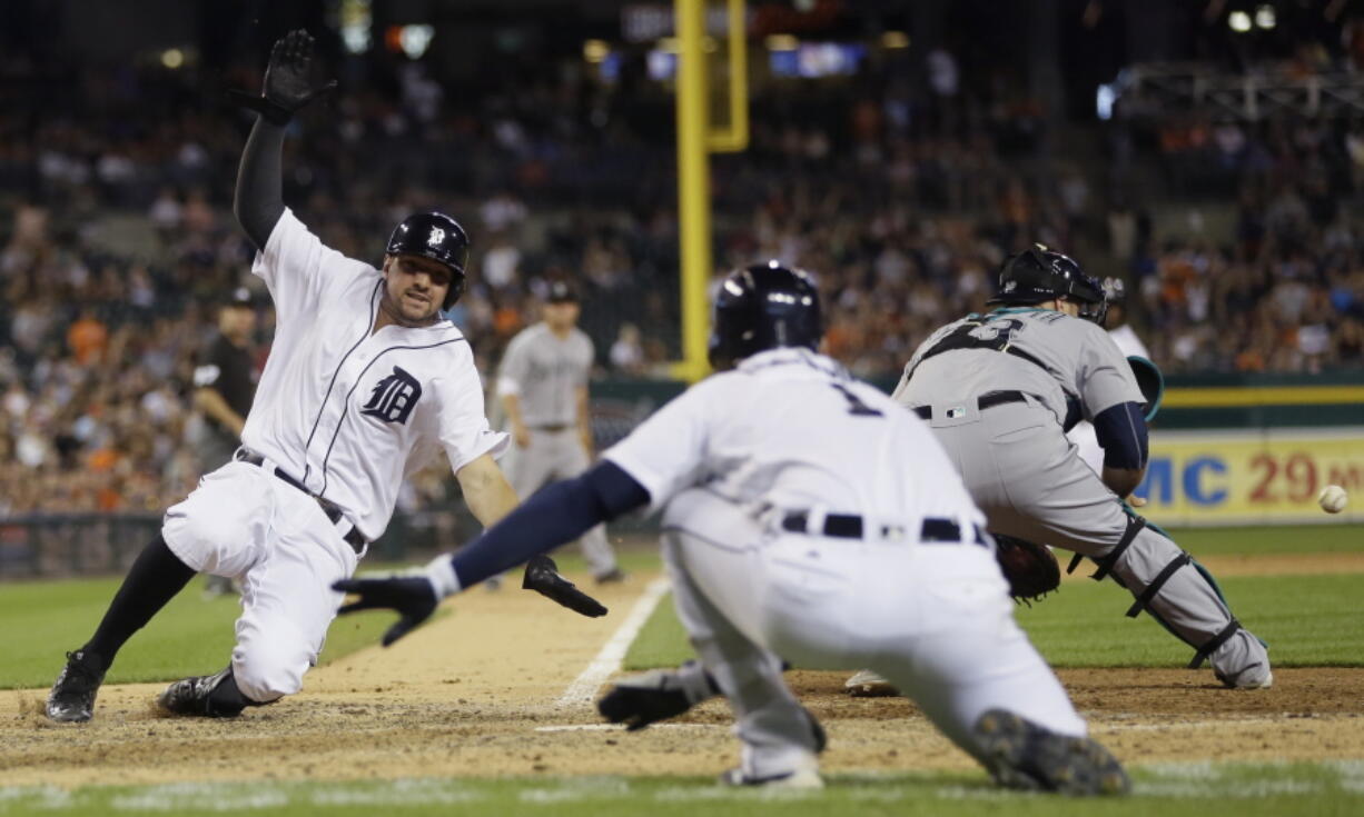 Detroit Tigers&#039; Nick Castellanos scores on a sacrifice by James McCann during the eighth inning of a baseball game against the Seattle Mariners, Tuesday, June 21, 2016 in Detroit.