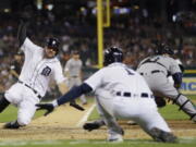 Detroit Tigers&#039; Nick Castellanos scores on a sacrifice by James McCann during the eighth inning of a baseball game against the Seattle Mariners, Tuesday, June 21, 2016 in Detroit.